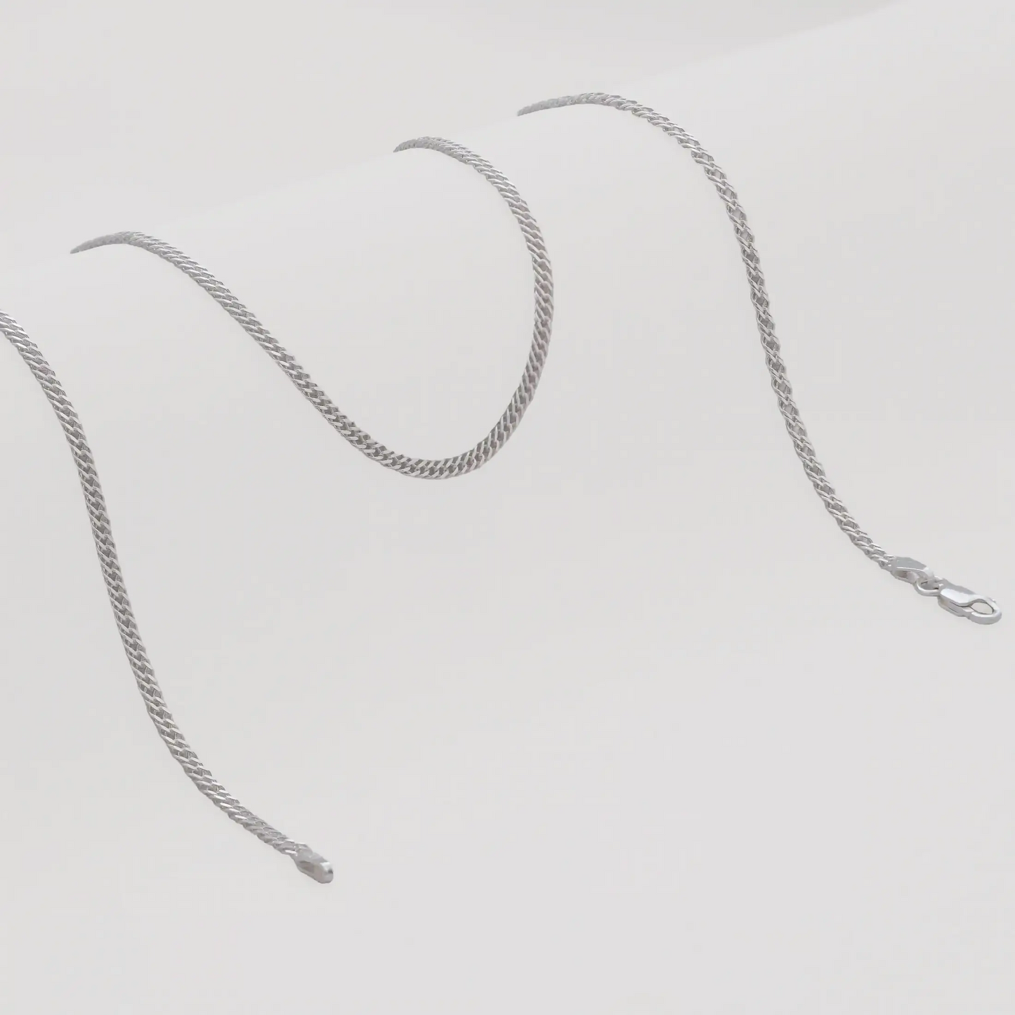 Cadena Cubana Cruzada 2,4mm 65cms